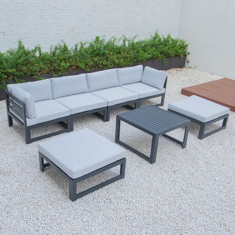 Chelsea 7-Piece Patio Ottoman Sectional And Coffee Table Set Black Aluminum With Cushions